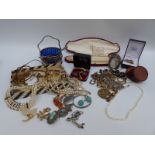 A collection of costume jewellery including mother of pearl necklace, silver brooches,