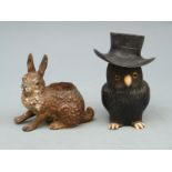 A cold painted pen wipe in the form of a hare and an owl inkwell,