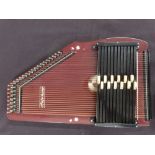 Musima autoharp, German made, in lacquered finish with 32 strings and 12 chords,
