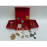 A collection of costume jewellery including abalone pin, enamel brooches, mother of pearl pendant,