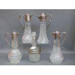 Five various silver plated and glass claret jugs