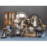 A quantity of silver plate to include spirit kettle on wood branch effect stand, cutlery,