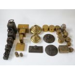 A quantity of various weights including coin weights, cast iron weights, Avery test weights,