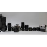 A quantity of cameras and accessories including Canon EOS 3000, Sigma 400mm 1:5.