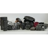 Canon A-1 SLR camera with 50mm 1:1:8 lens, Canon 75-200m 1:4:5 lens, Canon Coronet QL19 camera,