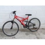 Trax red mountain bike with full suspension
