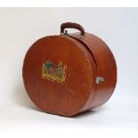 A vintage leather hat box with remains of label for a hotel in Den Haag,