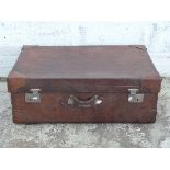 Large leather suitcase or trunk with corner protectors and lined interior,