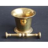 An 18thC/19thC bronze or brass pestle and mortar