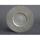 Pewter platter with crest to top,