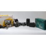 A collection of vintage cameras and home movie equipment to include Olympus Trip 35,