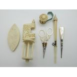 A group of mother of pearl and bone sewing accessories to include spool holder,