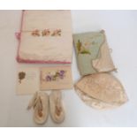 A collection of embroidered and other christening gifts, baby's kid shoes,