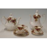 Royal Albert Old County Roses tea, coffee and dinnerware, approximately 60 pieces including a clock,