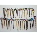 A collection of largely Victorian lace making bobbins including bone,