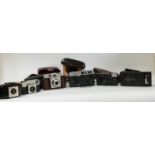 Quantity of various cameras including Kodak folding example, Canon Canonet,