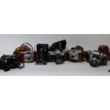 Quantity of cameras and accessories including Canon AV1 with 50mm 1:1.