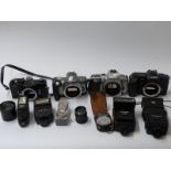 A quantity of SLR cameras and accessories including Minolta 5000, Cosina CSM, Canon EOS 300X,