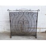 A blacksmith made iron fire guard,