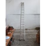 Two aluminium extending ladders, each section approximately 4.