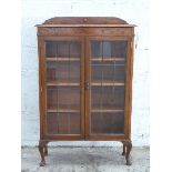 Glazed oak bookcase with adjustable shelves,