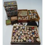 A large quantity of needlework related items including mother of pearl cotton reels,