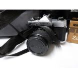 A quantity of cameras and accessories, including Olympus OM-2, Olympus 1:4,5 f=300mm lens,