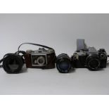 Olympus OM10 SLR camera with 50mm 1:1.8 lens, Miranda 70-210mm 1:4.5-5.6 and 35-70mm 1:3.5-4.
