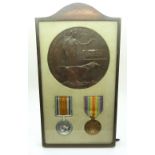 British Army WWI medal pair comprising War Medal and Victory Medal framed with the death plaque for
