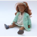 Sasha doll with brown lips, blue eyeshadow, red hair, blue shoes and knitted outfit, 41cm tall.