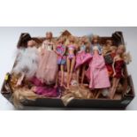 Approximately thirty Barbie dolls of differing ages