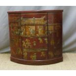 A Chinese lacquer side cabinet with red ground and lacquer figure decoration,