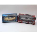 Two diecast model cars JoyRide RC2 James Bond 007 Goldfinger 1965 Aston Martin DB5 80792 and Solido