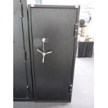 A 24 gun safe / cabinet with two keys,