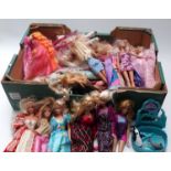 Approximately thirty Barbie dolls of differing ages