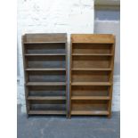 A pair of Arts & Crafts oak waterfall bookcases, by repute Sir Giles Gilbert Scott,