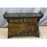 A Chinese sideboard with lacquer decoration depiciting figures,