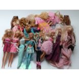 Approximately thirty Barbie dolls of differing ages