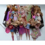 Approximately thirty Barbie dolls of differing ages