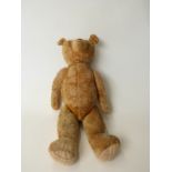 Blonde mohair straw filled Teddy bear with growler, disc joints, cocked feet and humped back,