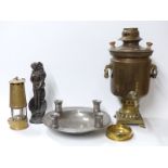 A pewter bowl with four integral candle holders, copper samovar,