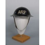 WWII ARP steel helmet complete with liner and chin strap