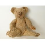 A vintage blonde mohair Teddy bear with disc joints,