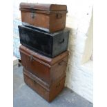 Four vintage metal or metal bound trunks,