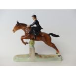 Beswick figure of a lady riding sidesaddle jumping a fence