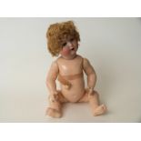 German bisque headed doll with open mouth, fixed blue eyes,