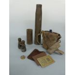 WWI enamel water flask in original webbing carrier, two shell cases, military binoculars,