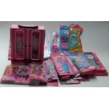 Collection of Barbie doll clothes and accessories in original packaging,