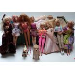 Approximately thirty Barbie dolls of differing ages