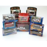 Twelve Corgi diecast moel vehicles including Eddie Stobart, Royal Mail, police cars,